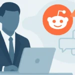 A business person in an office looks at Reddit on a laptop, with charts and graphs on a screen nearby.