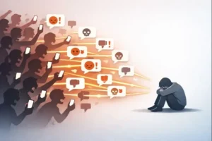 A drawing of a large crowd with their phones pointed at one person standing alone on a stage. The crowd looks angry, and bright, chaotic lines show comments and likes flying from the phones.