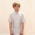 Will Theron Roth as a young boy at a public event wearing a white shirt