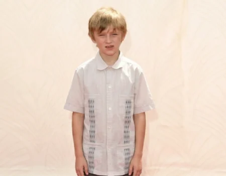 Will Theron Roth as a young boy at a public event wearing a white shirt