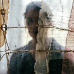 Abstract mixed media concept with layered fabric, stitched threads, and fragments of handwritten text in muted tones, representing themes of identity and memory.