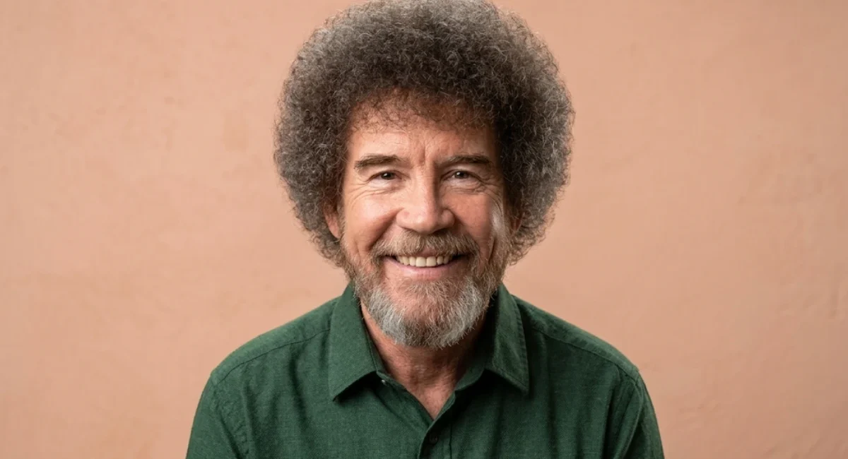Bob Ross net worth 2026 - painter and TV host holding paintbrush in front of canvas