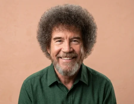 Bob Ross smiling with his signature curly hair and paintbrush, representing his net worth and brand legacy in 2026