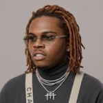 Gunna net worth 2026 — rapper standing in luxury outfit representing his financial growth