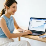 Person tracking how to grow Facebook page organically with rising follower graph on laptop